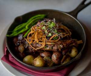 seared steak over potatoes